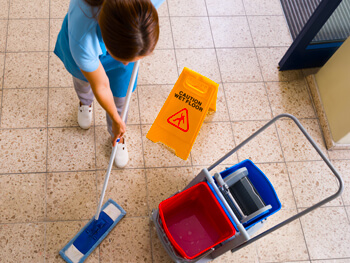 Woman mopping floor